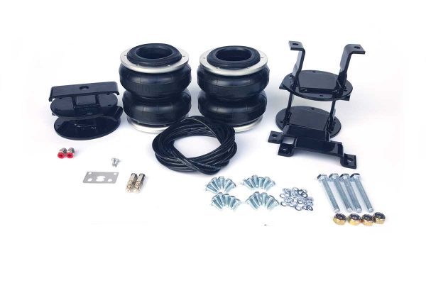 A Nissan Navara 4WD D22 D40 Airbag Suspension - Boss kit for a black Nissan Navara 4WD car with bolts and nuts.