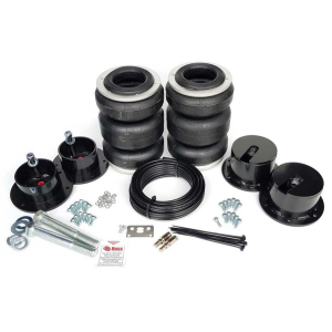 A Ford F100 73-79 Coil Replacement - Boss suspension kit with a tire and bolts.