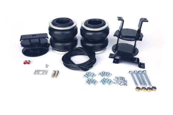 A Mitsubishi Triton 4WD Airbag Suspension - Boss suspension kit for a black car with bolts and nuts.