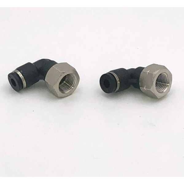 Two black plastic fittings on a white background.