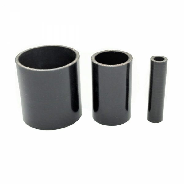 Three black plastic cylinders on a white background.